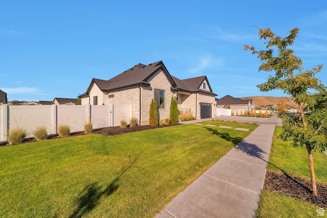 1521 E Thorpe Dr, Eagle Mountain, UT 84005 - view of front of home with a front lawn, fence, a garage, and a residential view