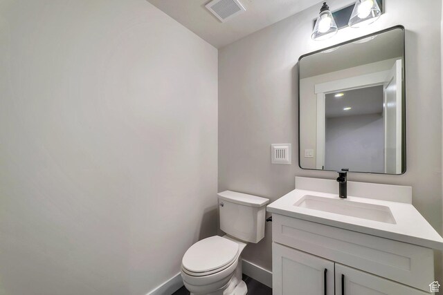 1521 E Thorpe Dr, Eagle Mountain, UT 84005 - half bathroom with visible vents, toilet, vanity, and baseboards