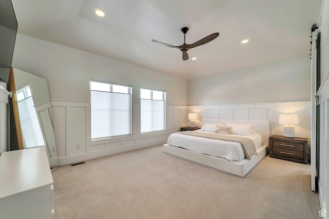 1521 E Thorpe Dr, Eagle Mountain, UT 84005 - bedroom with visible vents, light carpet, a wainscoted wall, recessed lighting, and a barn door