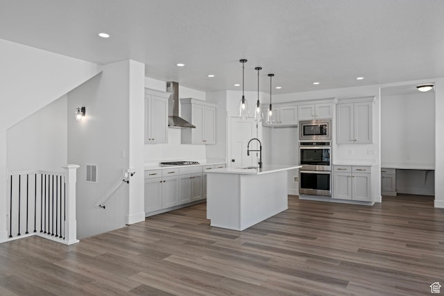 1504 S Lukas Ln, Saratoga Springs, UT 84045 - kitchen featuring sink, hanging light fixtures, a center island with sink, appliances with stainless steel finishes, and wall chimney range hood