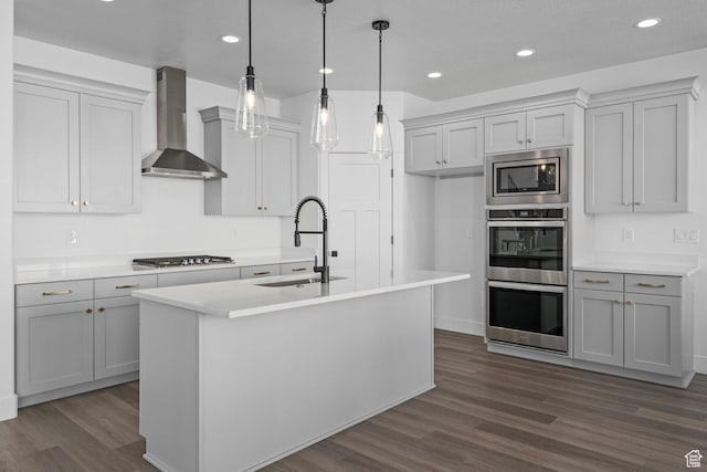 1504 S Lukas Ln, Saratoga Springs, UT 84045 - kitchen featuring hanging light fixtures, sink, a kitchen island with sink, and wall chimney range hood