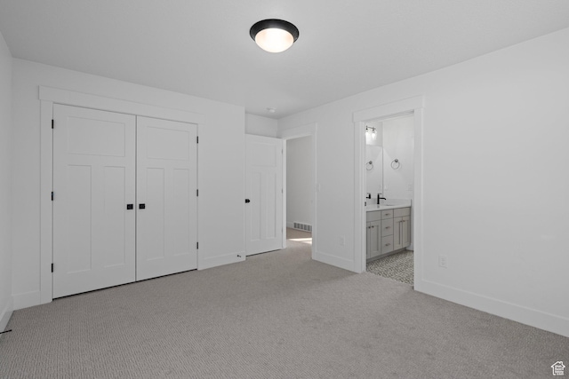 1504 S Lukas Ln, Saratoga Springs, UT 84045 - unfurnished bedroom with a closet, connected bathroom, sink, and light carpet