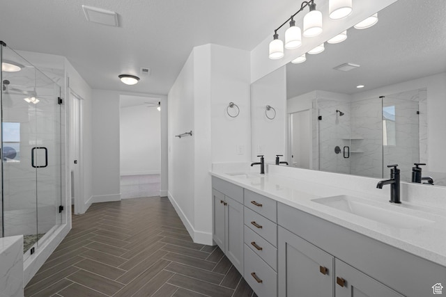 1504 S Lukas Ln, Saratoga Springs, UT 84045 - bathroom featuring vanity, a textured ceiling, a shower with shower door, and ceiling fan