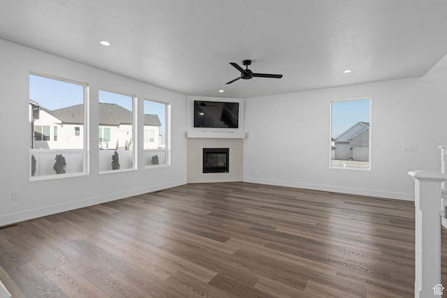 1504 S Lukas Ln, Saratoga Springs, UT 84045 - unfurnished living room with dark wood-type flooring and ceiling fan