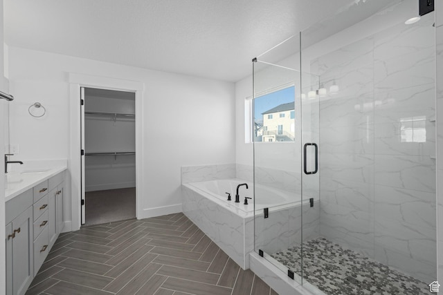 1504 S Lukas Ln, Saratoga Springs, UT 84045 - bathroom featuring vanity, independent shower and bath, and a textured ceiling