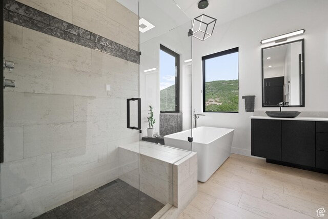 11515 N White Tail Ct, Hideout, UT 84036 - full bathroom with vanity, a shower stall, and a freestanding bath