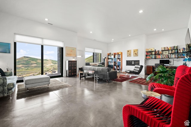 11515 N White Tail Ct, Hideout, UT 84036 - living room featuring concrete flooring and recessed lighting