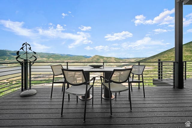11515 N White Tail Ct, Hideout, UT 84036 - wooden terrace featuring outdoor dining area and a mountain view