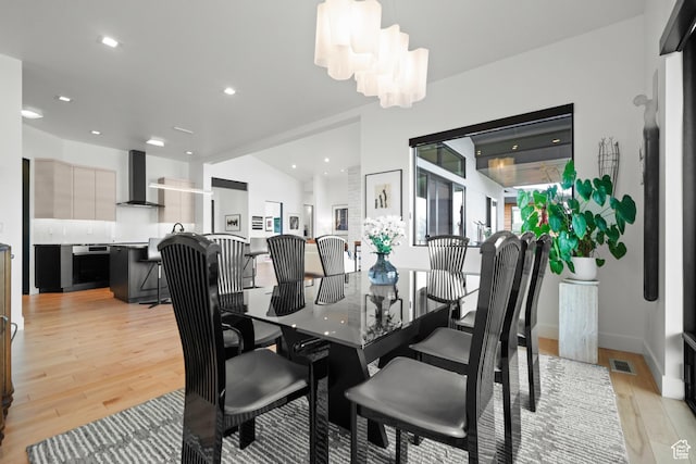 11515 N White Tail Ct, Hideout, UT 84036 - dining space featuring vaulted ceiling, recessed lighting, baseboards, light wood-style floors, and visible vents