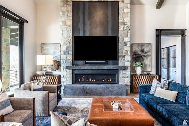 149 N Haystack Mountain Dr, Heber City, UT 84032 - living area featuring a stone fireplace and wood finished floors