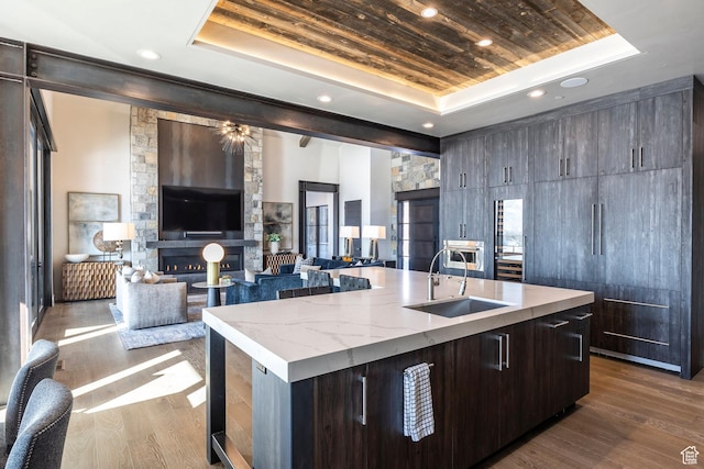 149 N Haystack Mountain Dr, Heber City, UT 84032 - kitchen with a tray ceiling, a sink, an island with sink, wood ceiling, and dark wood-style floors
