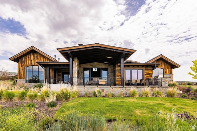 149 N Haystack Mountain Dr, Heber City, UT 84032 - rear view of house featuring stone siding and a lawn