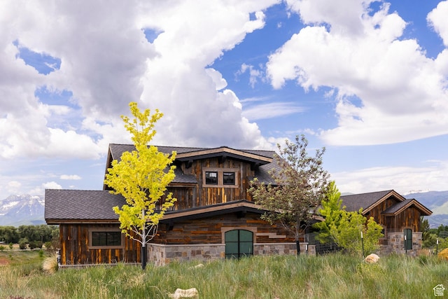 149 N Haystack Mountain Dr, Heber City, UT 84032 - view of front of house featuring stone siding, a mountain view, and board and batten siding