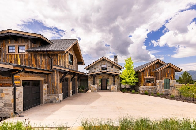149 N Haystack Mountain Dr, Heber City, UT 84032 - view of front of property with stone siding, concrete driveway, and an attached garage