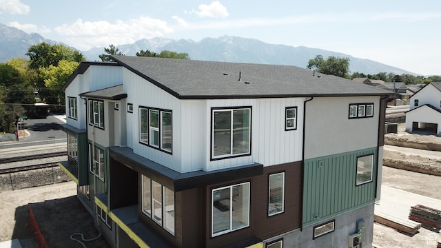 view of side of home featuring a mountain view