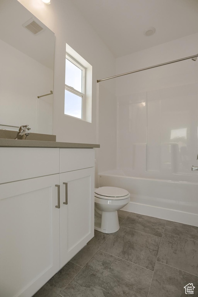 full bathroom with vanity, tub / shower combination, and toilet