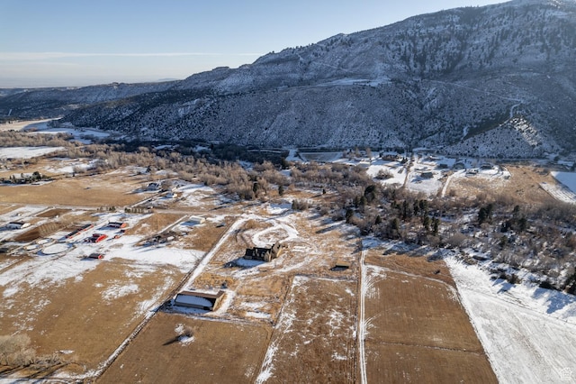 7748 W Mountain Dell Dr, Vernal, UT 84078 - snowy aerial view featuring a mountain view