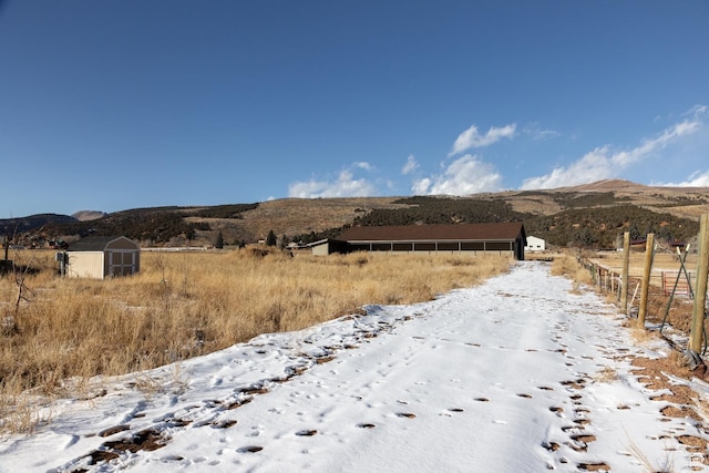 7748 W Mountain Dell Dr, Vernal, UT 84078 - view of street with a mountain view and a rural view