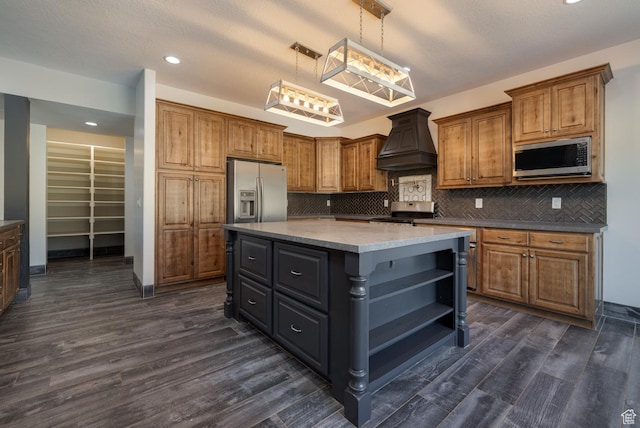 7748 W Mountain Dell Dr, Vernal, UT 84078 - kitchen with decorative light fixtures, dark hardwood / wood-style flooring, custom exhaust hood, a center island, and stainless steel appliances