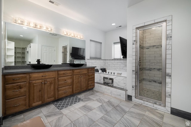 7748 W Mountain Dell Dr, Vernal, UT 84078 - bathroom featuring vanity and shower with separate bathtub