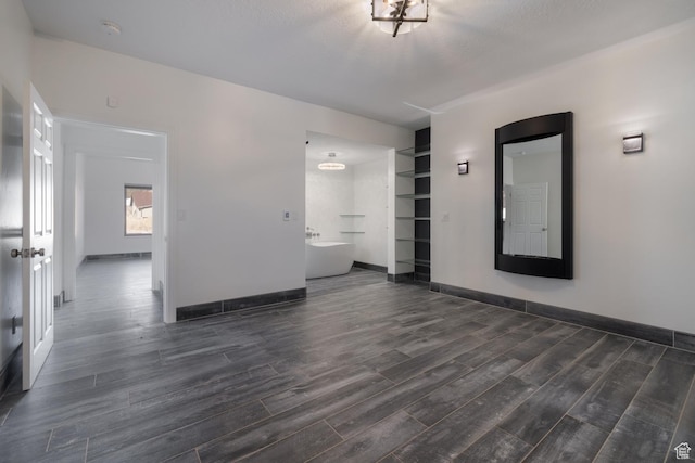 7748 W Mountain Dell Dr, Vernal, UT 84078 - spare room with dark wood-type flooring and a textured ceiling
