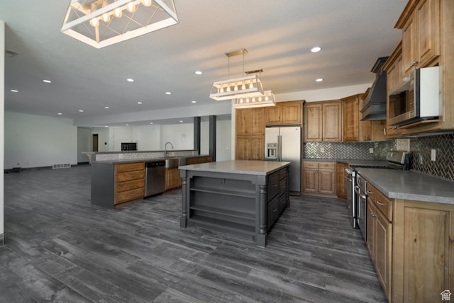 7748 W Mountain Dell Dr, Vernal, UT 84078 - kitchen featuring decorative light fixtures, a center island, dark hardwood / wood-style flooring, stainless steel appliances, and decorative backsplash
