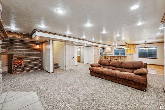 12159 S Swensen Cir, Riverton, UT 84096 - living room featuring ornamental molding, recessed lighting, stairway, baseboards, and light carpet