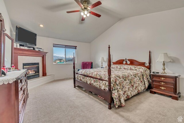 12159 S Swensen Cir, Riverton, UT 84096 - bedroom featuring a tile fireplace, carpet floors, vaulted ceiling, ceiling fan, and baseboards