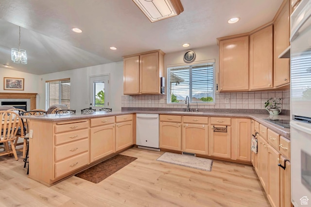 12159 S Swensen Cir, Riverton, UT 84096 - kitchen with light brown cabinetry, a sink, white appliances, and recessed lighting