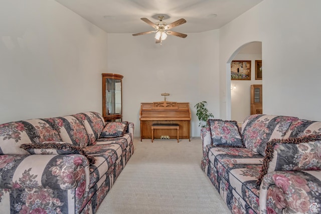 12159 S Swensen Cir, Riverton, UT 84096 - living room with arched walkways, ceiling fan, and light carpet