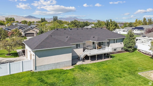 12159 S Swensen Cir, Riverton, UT 84096 - rear view of property with a deck with mountain view, a shingled roof, stucco siding, and a residential view