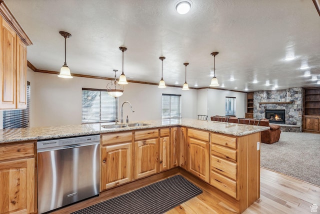 12159 S Swensen Cir, Riverton, UT 84096 - kitchen with dishwasher, a sink, a stone fireplace, crown molding, and light wood finished floors