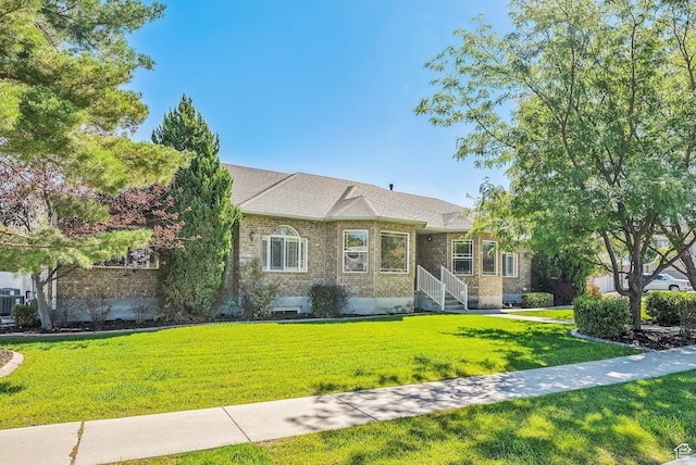 12159 S Swensen Cir, Riverton, UT 84096 - view of front of home featuring brick siding and a front lawn