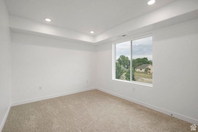 carpeted spare room with baseboards and recessed lighting