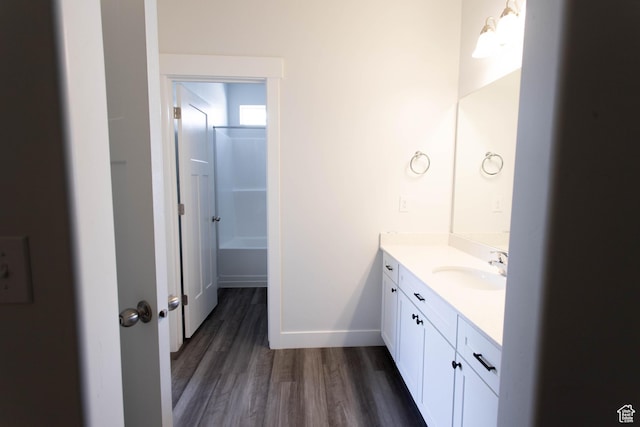 1454 N 3830 W Unit D201, Lehi, UT 84043 - full bathroom featuring vanity, baseboards, and wood finished floors