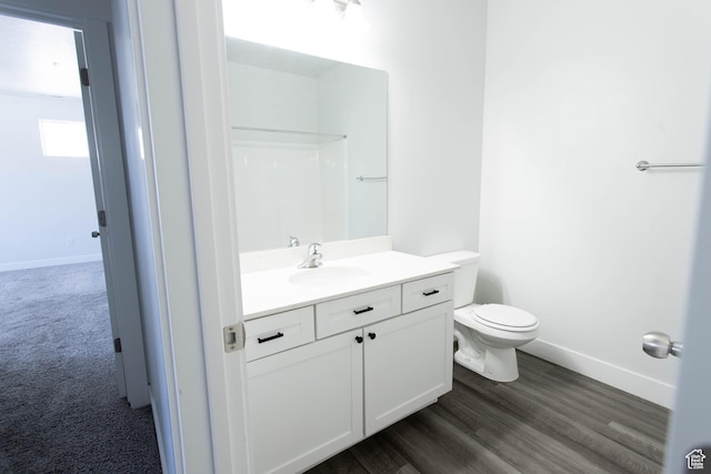 1454 N 3830 W Unit D201, Lehi, UT 84043 - bathroom with toilet, baseboards, wood finished floors, and vanity
