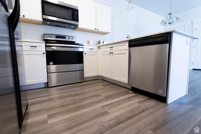 1454 N 3830 W Unit D201, Lehi, UT 84043 - kitchen with light wood-style floors, light countertops, appliances with stainless steel finishes, and white cabinets