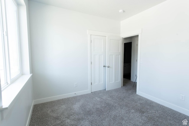 1454 N 3830 W Unit D201, Lehi, UT 84043 - unfurnished room with baseboards and carpet