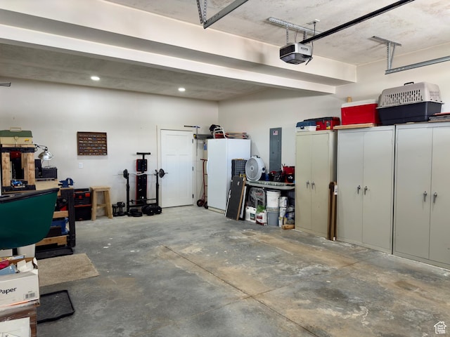 1610 N Mackinaw Way, Garden City, UT 84028 - garage with electric panel and a garage door opener