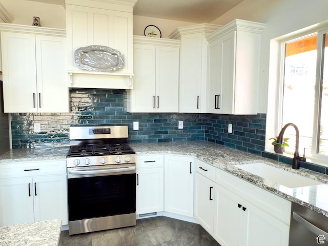 1610 N Mackinaw Way, Garden City, UT 84028 - kitchen featuring white cabinets, a sink, stainless steel appliances, and plenty of natural light