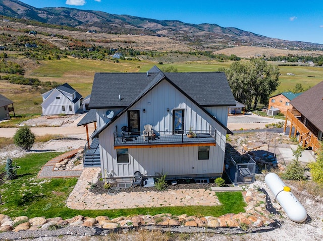 1610 N Mackinaw Way, Garden City, UT 84028 - exterior space featuring stairs, a shingled roof, and a mountain view