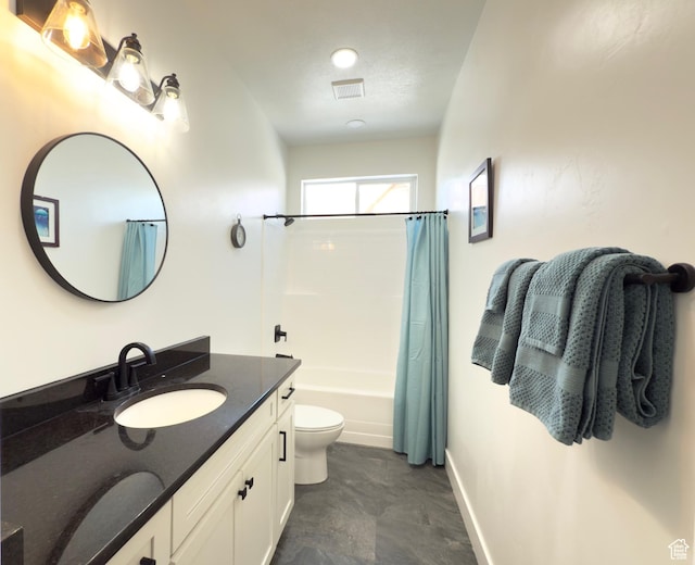 1610 N Mackinaw Way, Garden City, UT 84028 - full bathroom featuring baseboards, toilet, vanity, and shower / bath combo with shower curtain