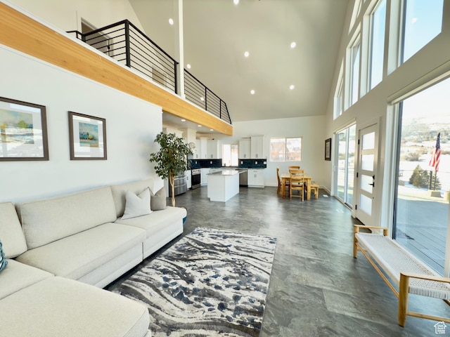 1610 N Mackinaw Way, Garden City, UT 84028 - living area featuring a wealth of natural light, a towering ceiling, and recessed lighting