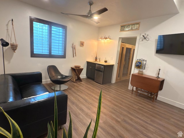 1610 N Mackinaw Way, Garden City, UT 84028 - living area featuring baseboards, indoor wet bar, wood finished floors, and ceiling fan