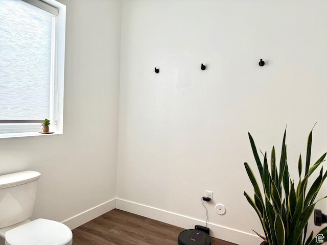 1610 N Mackinaw Way, Garden City, UT 84028 - bathroom featuring baseboards, wood finished floors, and toilet