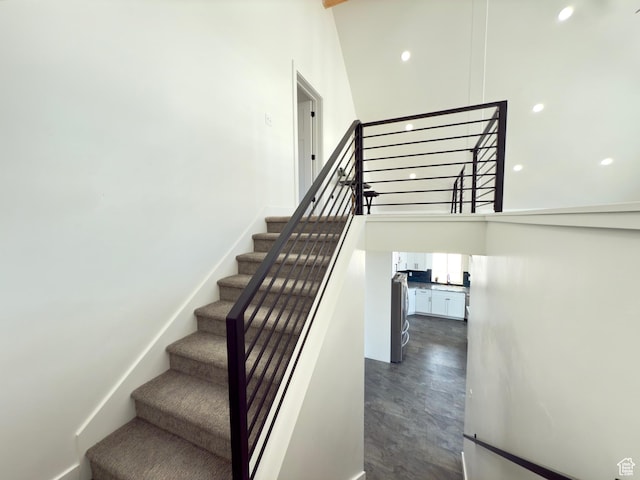 1610 N Mackinaw Way, Garden City, UT 84028 - staircase with a towering ceiling and baseboards