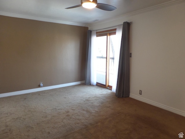 spare room featuring carpet floors, ornamental molding, and ceiling fan