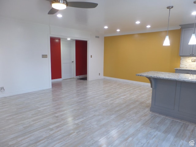 interior space featuring ceiling fan and light hardwood / wood-style flooring