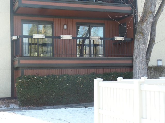 view of snow covered property entrance