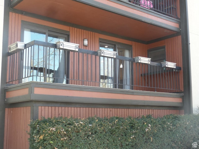 view of side of home with a balcony